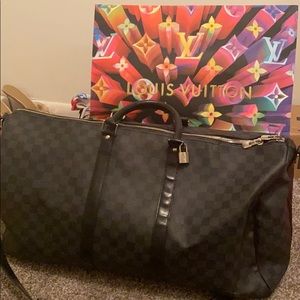 This is an AUTHENTIC Louis Vutton travel bag!